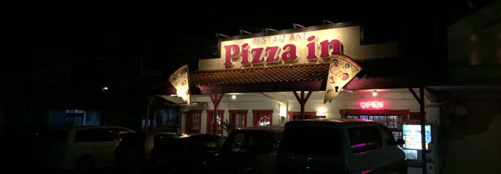 Pizza In Restaurant sign at Night