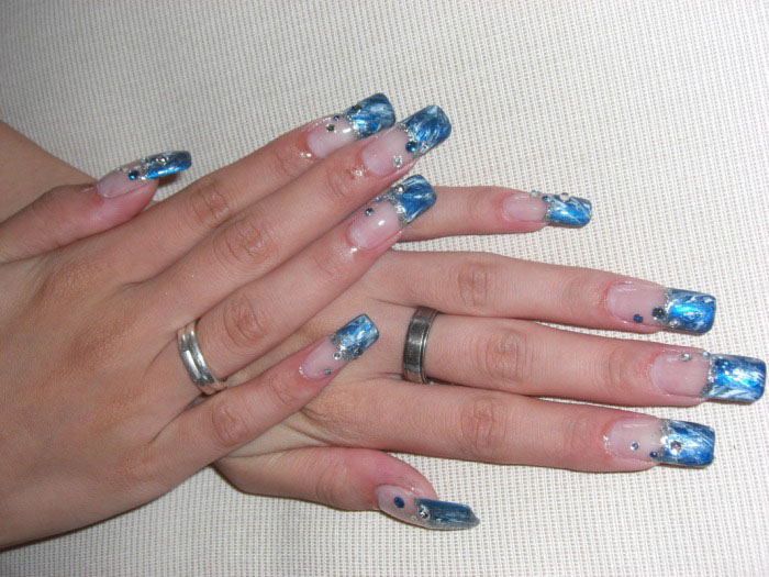 Woman's hands with blue marble effect nails
