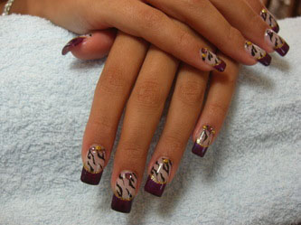 Woman's hands with black swirl nails
