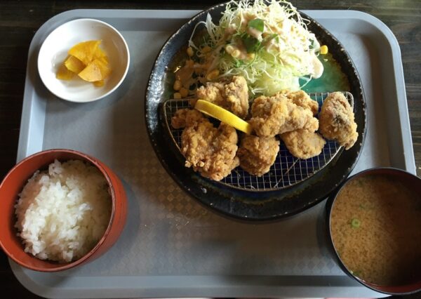 Fried chicken with miso soup, salad, pickled vegetables and rice