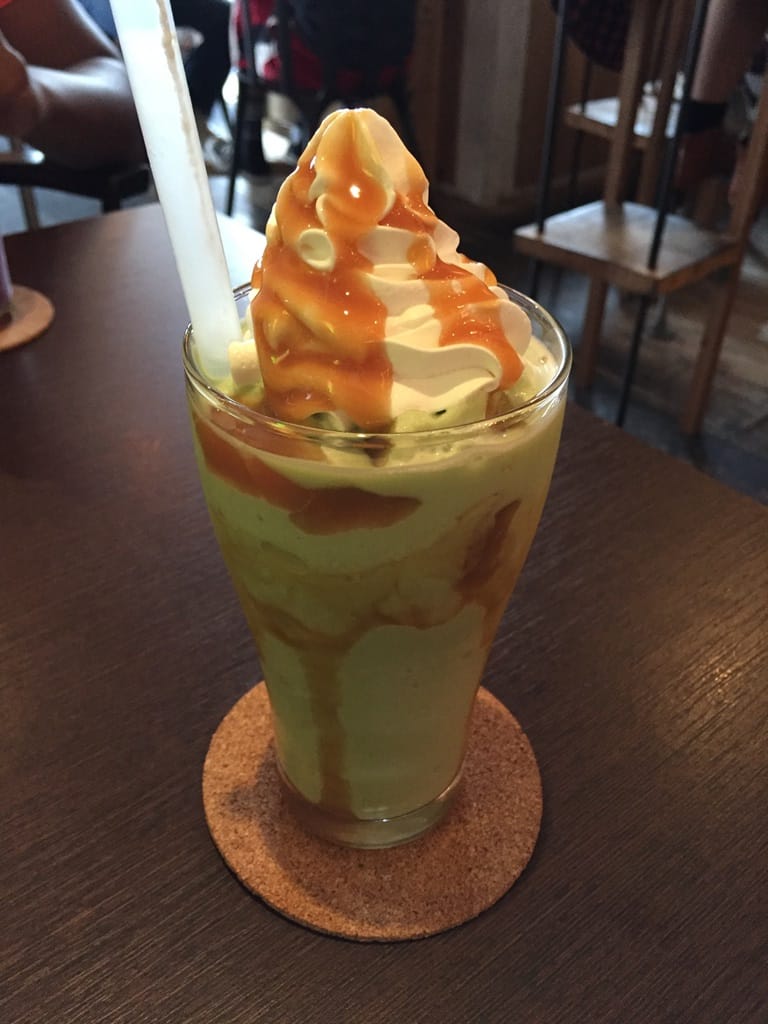Matcha smoothie with caramel and whipped cream