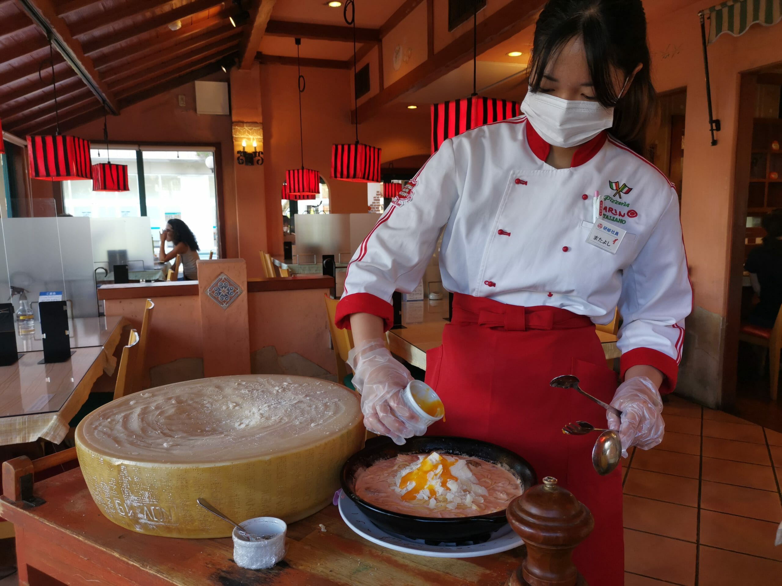 Chef preparing parmesan pasta at Marino's